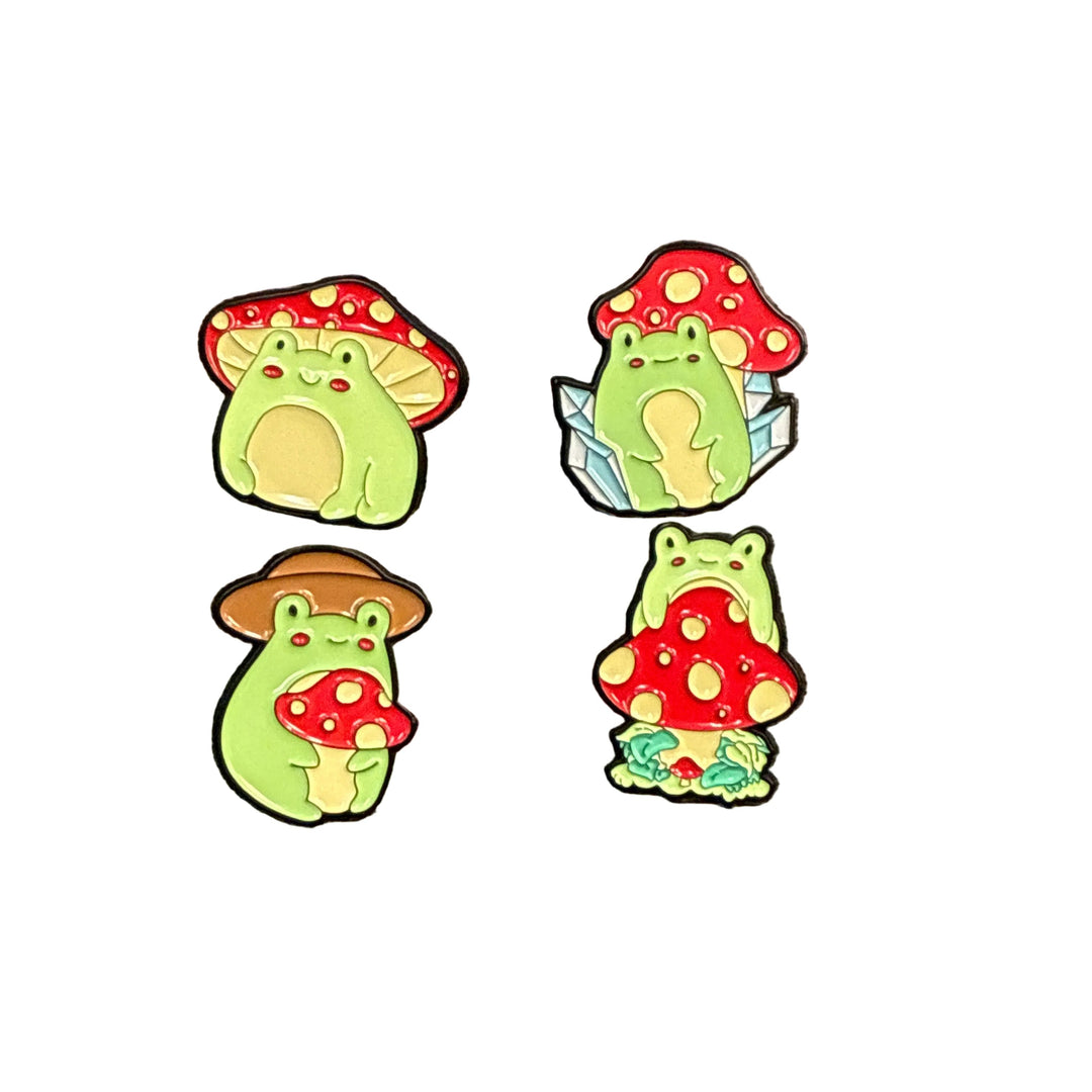 four colourful frog & mushroom hat pin on a white backround