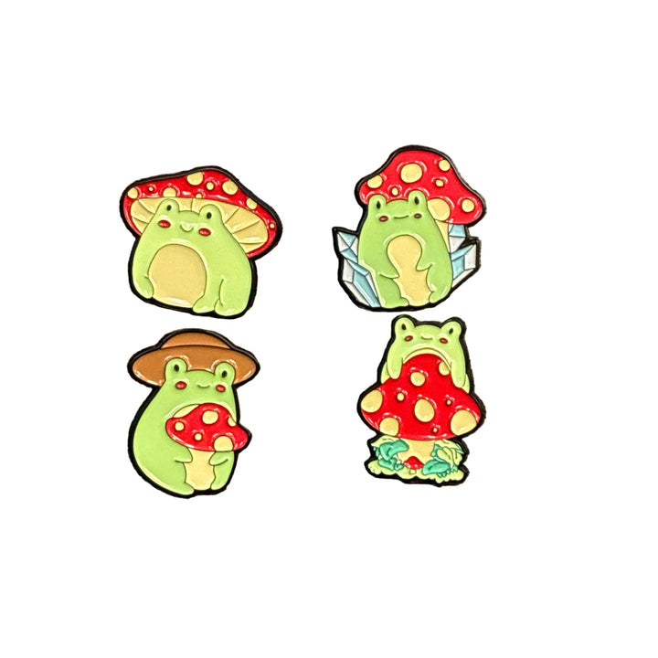 four colourful frog & mushroom hat pin on a white backround