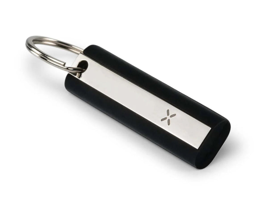 a small black and silver tool with a pax logo on the front on a white background