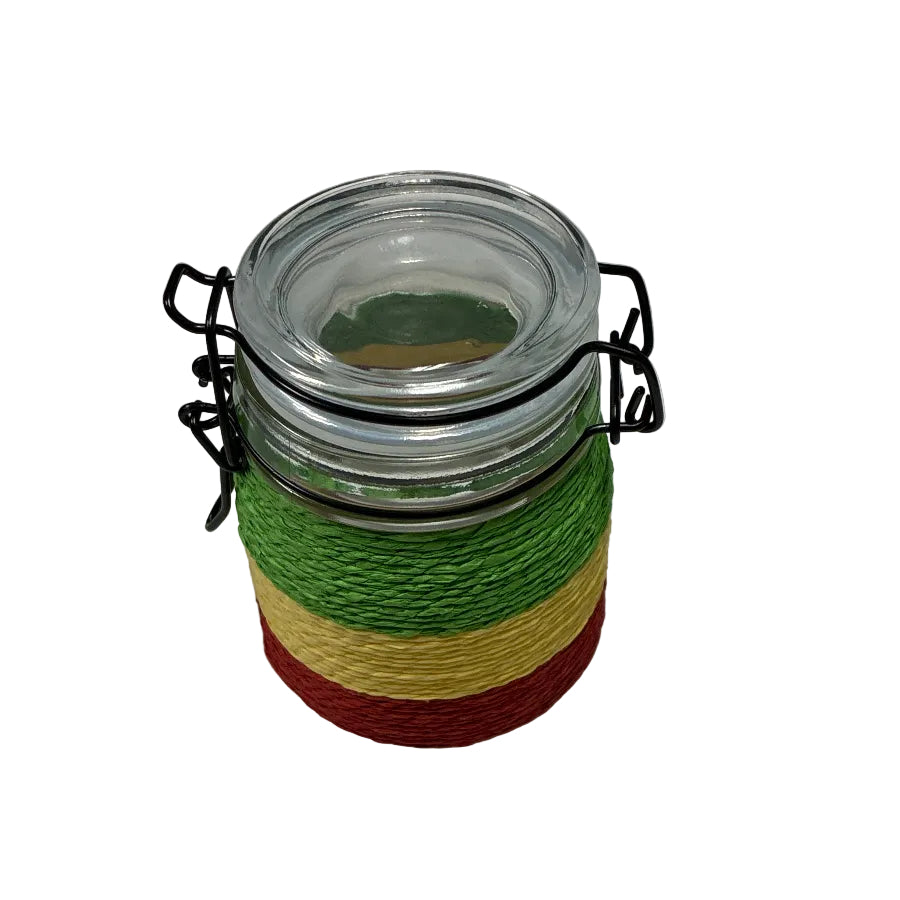 Jar with rast colour string spools on a whitebackground