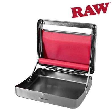 A RAW brand metal food warmer or press with an open lid showing a red fabric insert, photographed on a plain white background with the RAW logo in the top right corner.