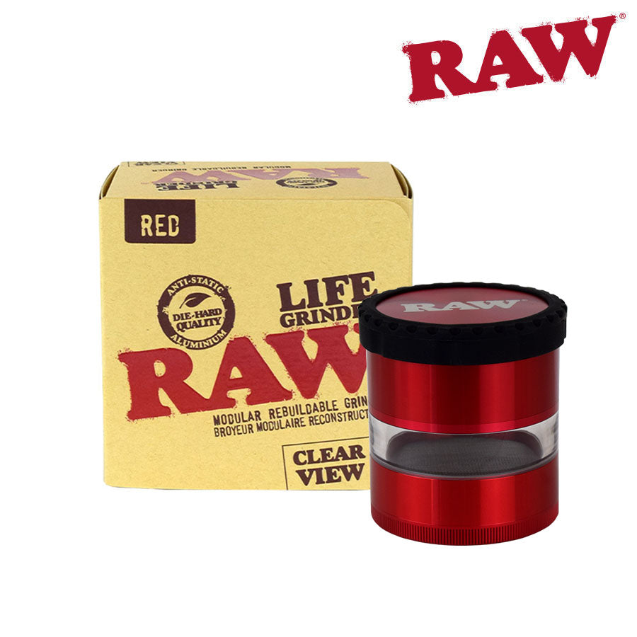 Red RAW grinder clear body with yellow packaging on a white background - shell shock