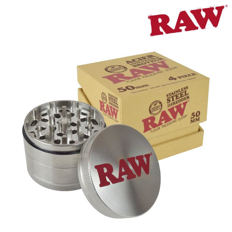 Silver grinder with 'RAW' branding next to a box of 'RAW' products on a white background.