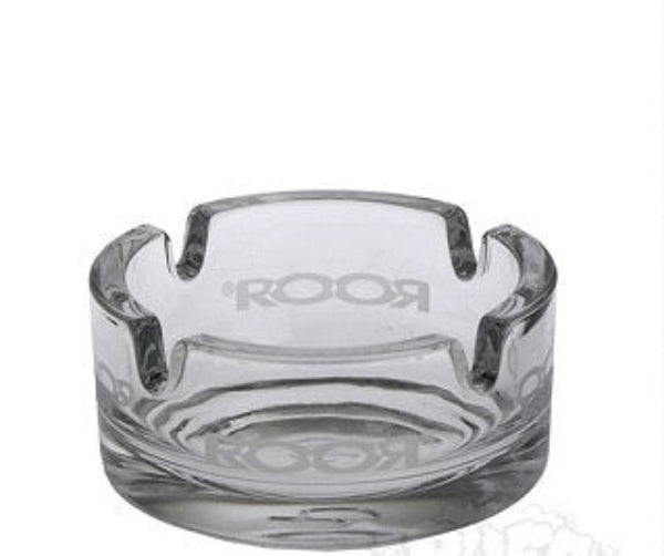 Clear glass ashtray with 'Room' branding on a white background