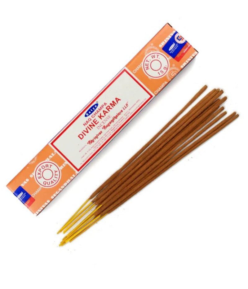 Box of Satya Divine Karma incense sticks on a white background