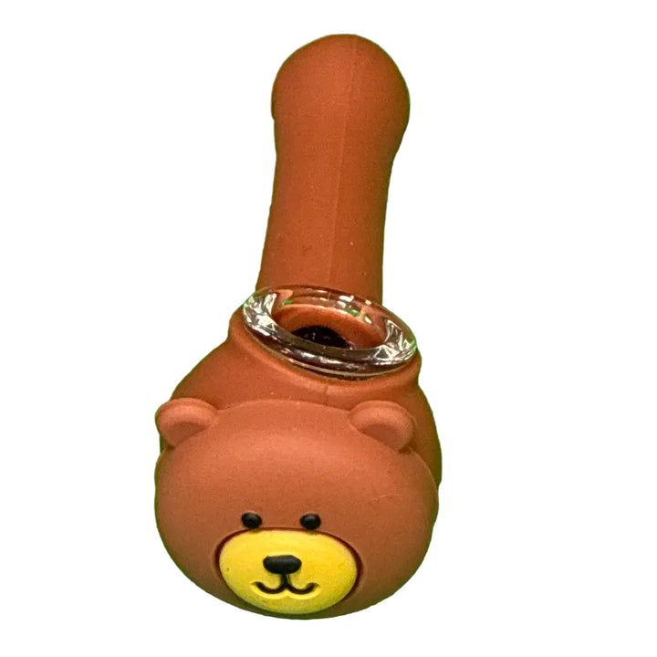 Brown bear-shaped pipe with a yellow face on a white background