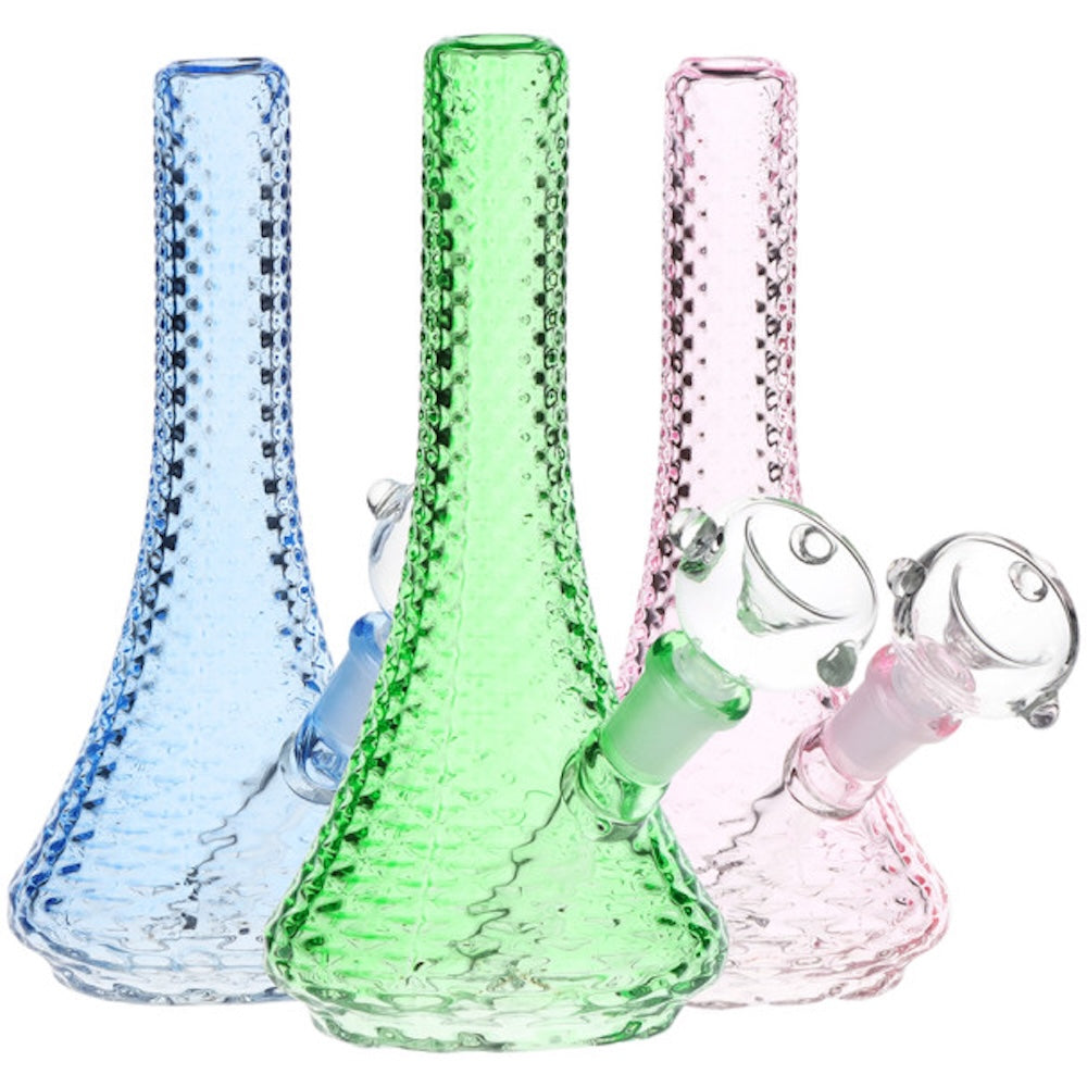 Three glass smoking accessories in blue, green, and pink on a white background