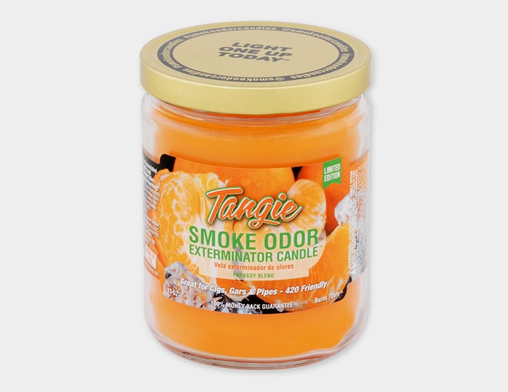 Tangie Smoke Odor Exterminator Candle in a jar with a yellow lid on a white background