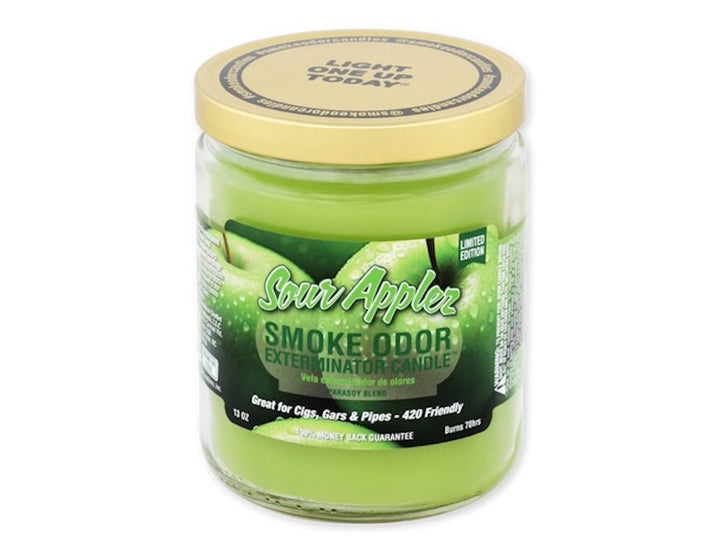 Jar of Sour Apple Smoke Odor Exterminator Candle with a yellow lid on a white background