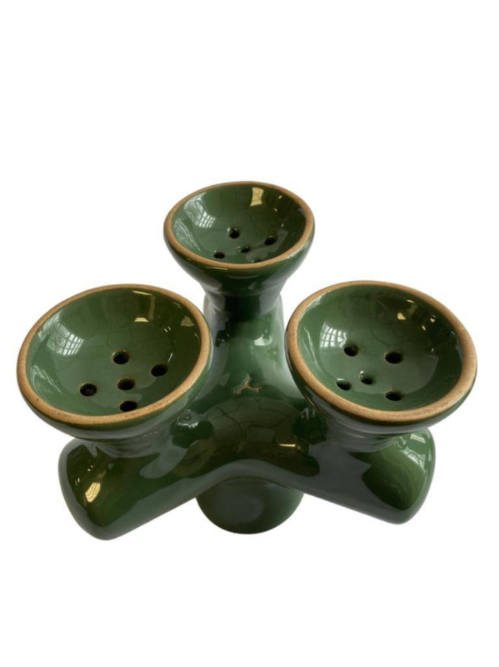 Green ceramic three-basin holder on a white background