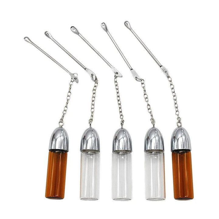 glass vial with spoon attached - Shell Shock