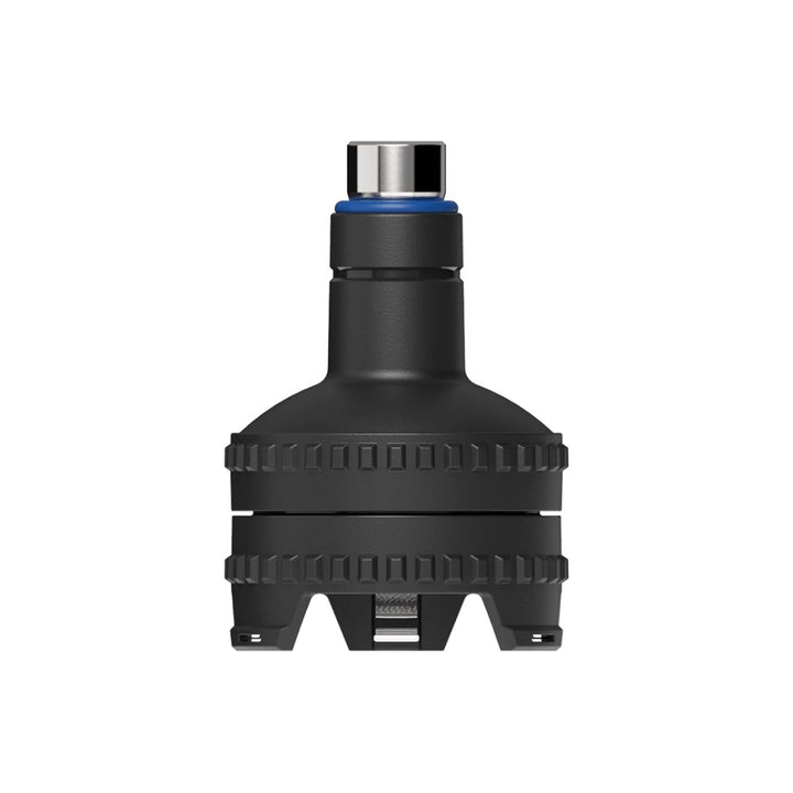 Black mechanical component with a metallic top on a white background