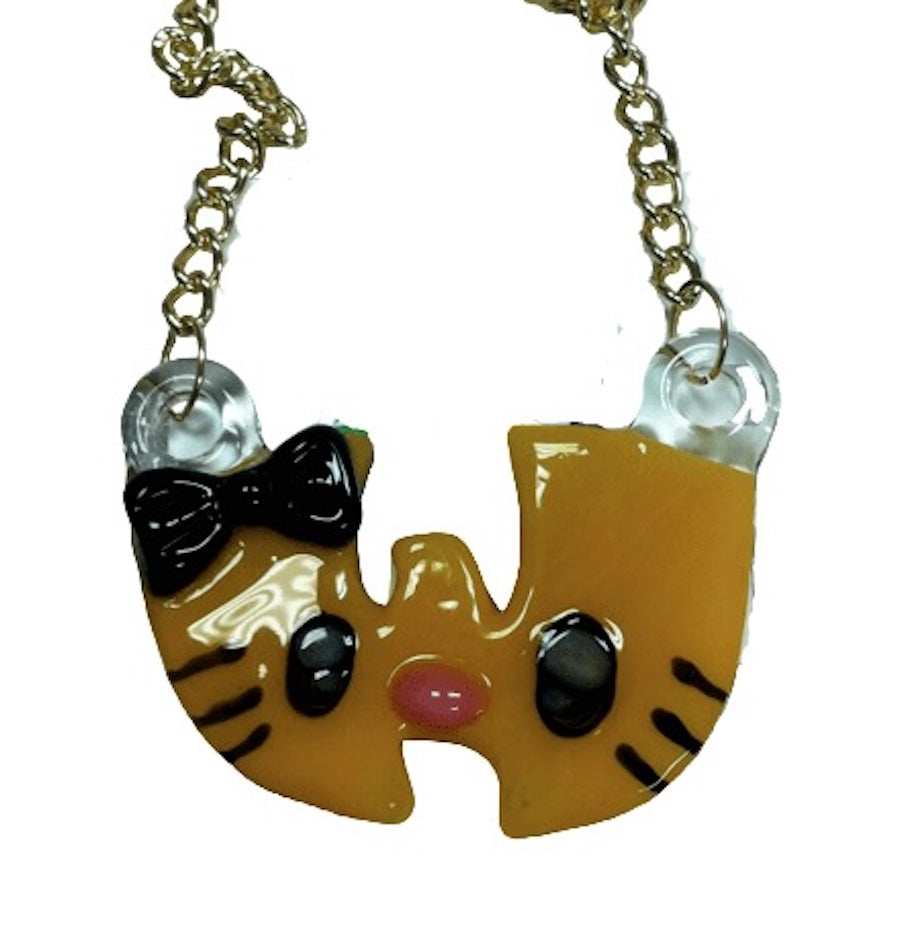 Wu-tang-shaped pendant with a cat with a bow tie on a chain against a white background