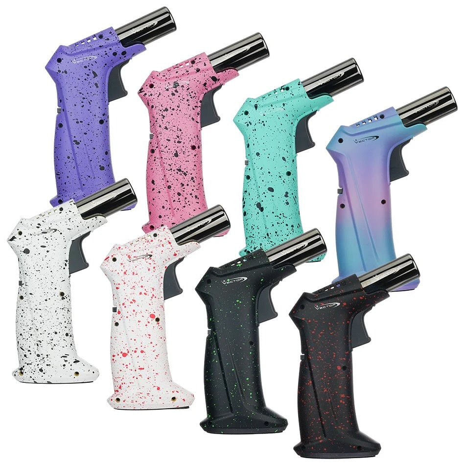 Six torch lighters with textured speckled handles in purple, pink, mint green, blue-purple, white, and black, arranged diagonally on a solid white background.