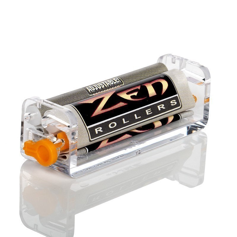 Adjustable ZED ROLLERS tattoo machine with a clear acrylic casing, black and gold patterned roller, and an orange adjustment knob, shown on a reflective white background.