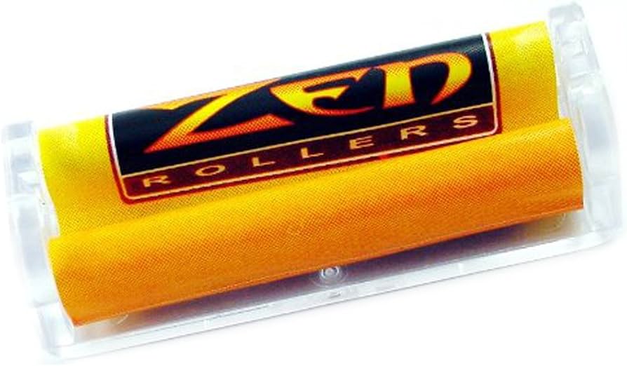 A yellow textured cylindrical product inside a clear plastic case, featuring a black label with the brand name 'ZED ROLLERS' in orange and yellow.